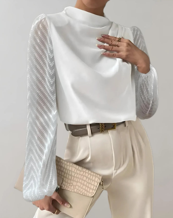 Lorene – witte damesblouse met mesh mouwen